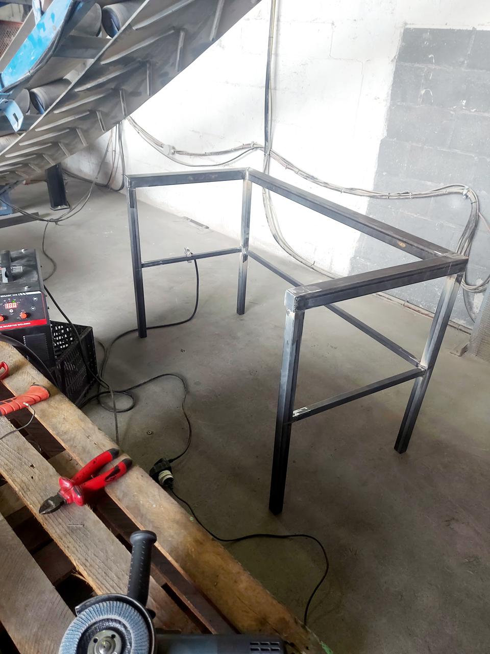 Certified welder working on a complex metal structure